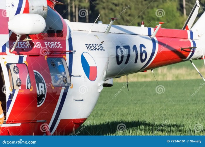 A rescue helicopter is lifting a man